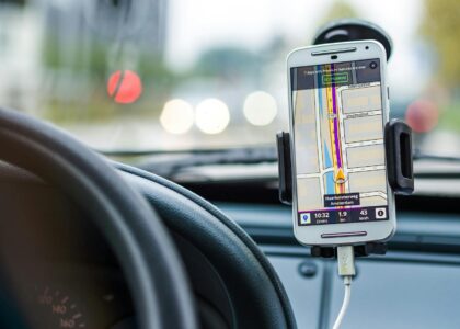 Smartphone mounted in car using GPS for navigation and directions.